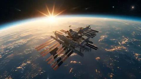 Still from Untethered: the space station above Earth at sunrise